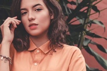 Brunnet young woman with orange shirt